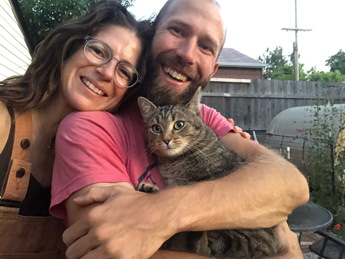 Kieth and rachel with their cat, owners of flower press studio